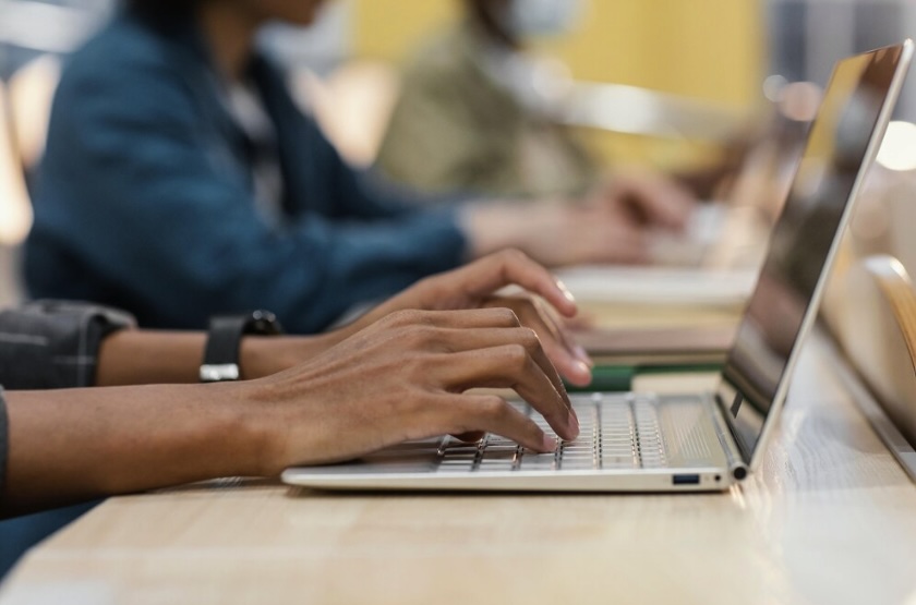 Person typing on laptop